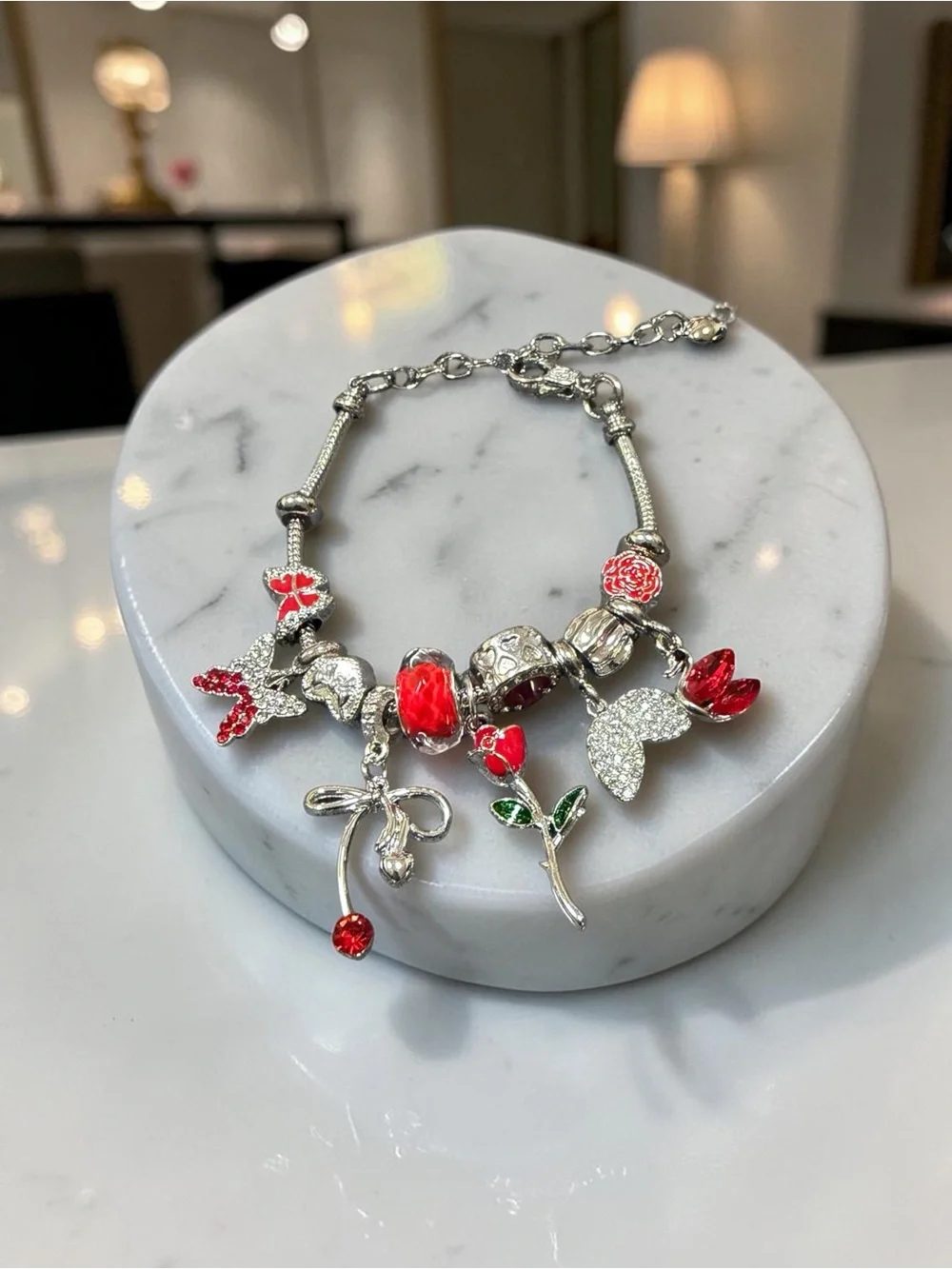 Silver Charm Bracelet with Red Floral and Crystal Accents